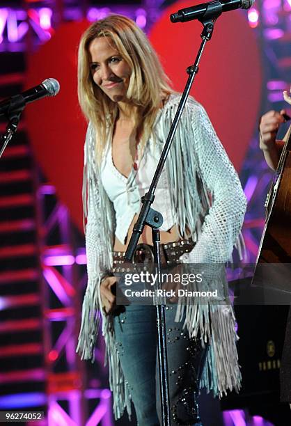 Musicians Sheryl Crow performs at the 2010 MusiCares Person Of The Year Tribute To Neil Young at the Los Angeles Convention Center on January 29,...