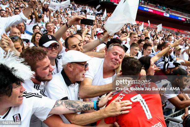 Marcus Bettinelli of Fulham celebrates with the fans during the Sky Bet Championship Play Off Final between Aston Villa and Fulham at Wembley Stadium...