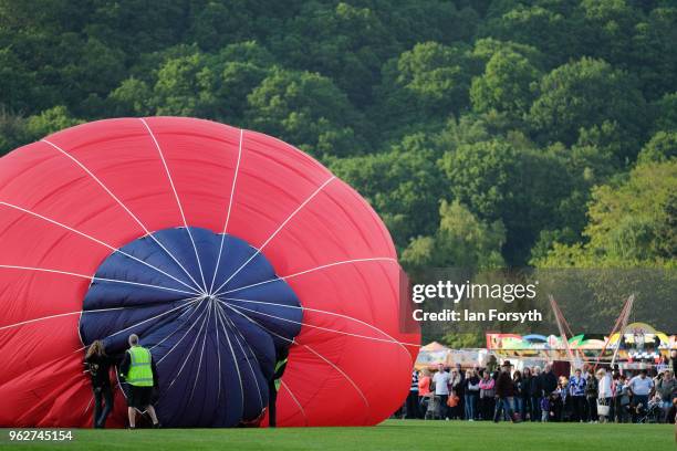 Balloon is inflated to test the strength of the wind as a decision is made about whether to carry out an evening take off during the Durham Hot Air...