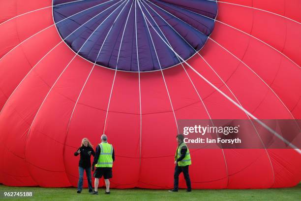 Balloon is inflated to test the strength of the wind as a decision is made about whether to carry out an evening take off during the Durham Hot Air...