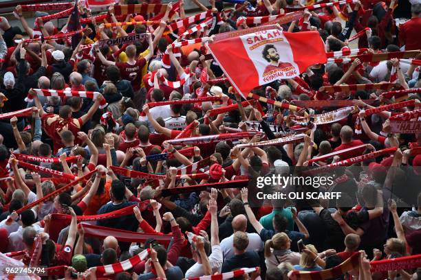 Liverpool fans watch a large screen in Anfield stadium in Liverpool, northern England on May 26, 2018 showing the UEFA Champions League final...