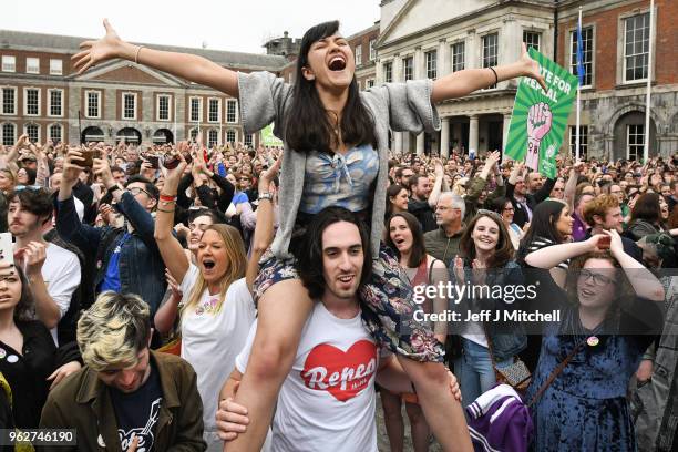 Supporters celebrate at Dublin Castle following the result Irish referendum result on the 8th amendment, concerning the country's abortion laws, on...