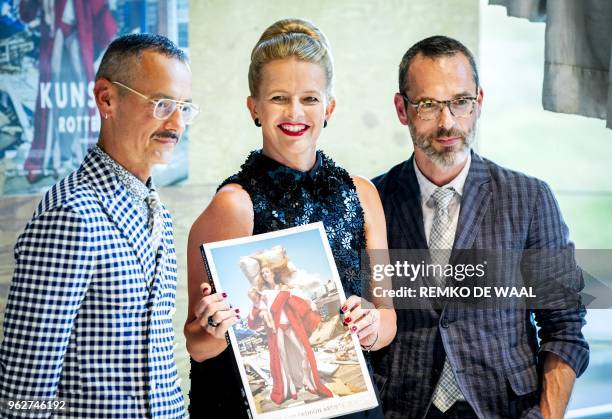 Dutch Princess Mabel poses with designers Viktor Horsting and Rolf Snoeren during the opening of the exhibition Viktor & Rolf at the Kunsthal...