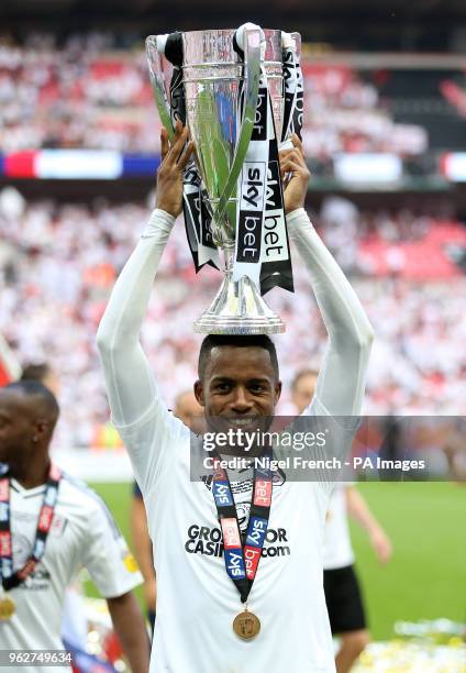 Fulham's Ryan Sessegnon fits the trophy after the final whistle during the Sky Bet Championship Final at Wembley Stadium, London.