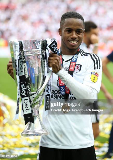 Fulham's Ryan Sessegnon fits the trophy after the final whistle during the Sky Bet Championship Final at Wembley Stadium, London.