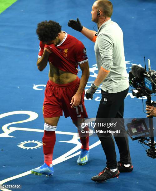 Mohamed Salah of Liverpool reacts whilst leaving the pitch during the UEFA Champions League Final between Real Madrid and Liverpool at NSC...