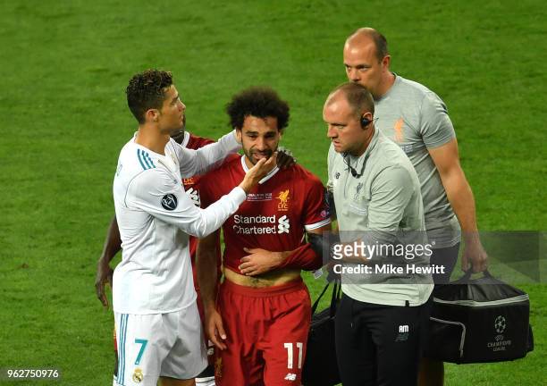 Cristiano Ronaldo of Real Madrid consoles Mohamed Salah of Liverpool as he leaves the pitch injured during the UEFA Champions League Final between...