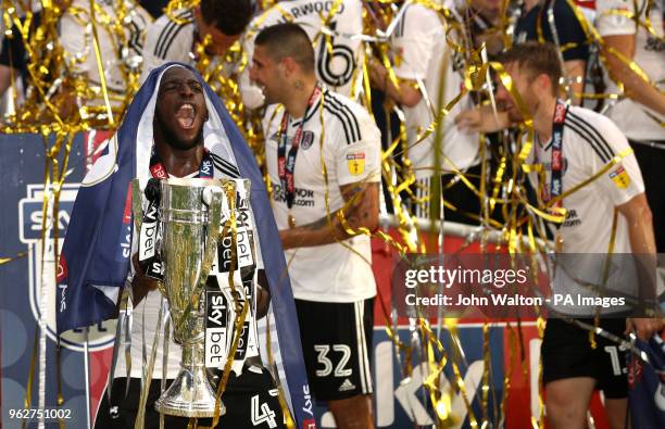 Fulham's Aboubakar Kamara with the trophy after the final whistle during the Sky Bet Championship Final at Wembley Stadium, London.