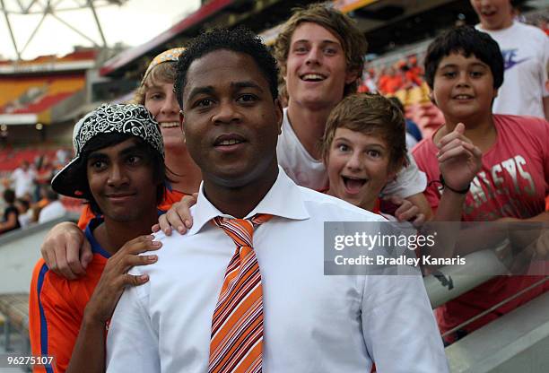 Former Dutch international player Patrick Kluivert poses with fans before the round 25 A-League match between the Brisbane Roar and Sydney FC at...