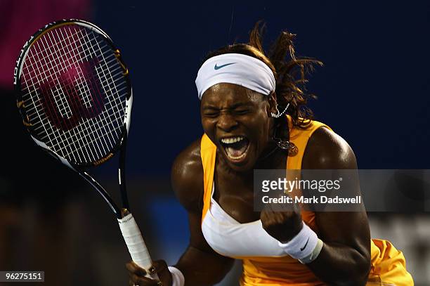Serena Williams of the United States of America celebrates winning a point in her women's final match against Justine Henin of Belgium during day...