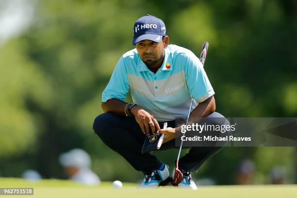 Anirban Lahiri of India looks over a putt on the 17th green during round three of the Fort Worth Invitational at Colonial Country Club on May 26,...