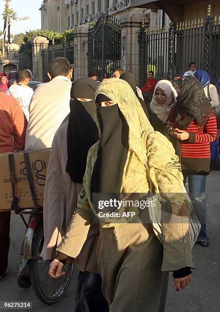 Egyptian students wearing the niqab, a veil which covers the face except for the eyes, exit Cairo University during exam week on January 27, 2010....