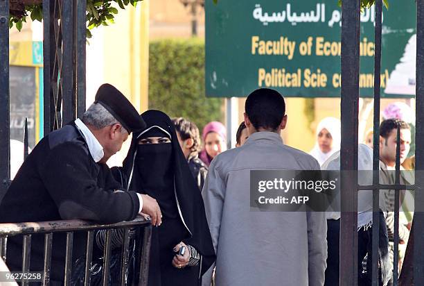 An Egyptian student wearing the niqab, a veil which covers the face except for the eyes, exits Cairo University during exam week on January 27, 2010....