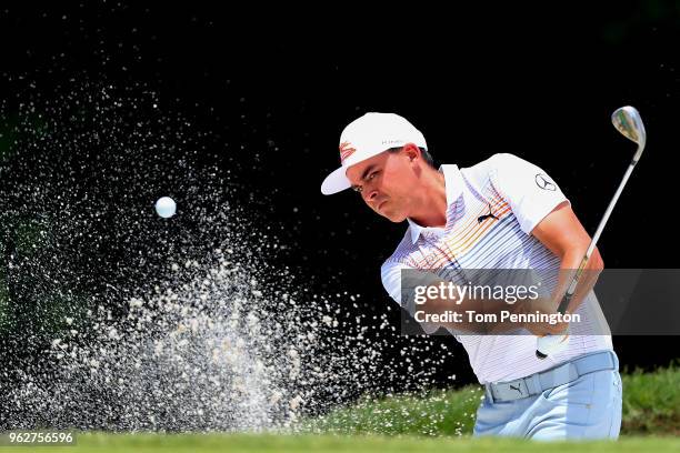 Rickie Fowler plays a shot from a bunker on the seventh hole during round three of the Fort Worth Invitational at Colonial Country Club on May 26,...