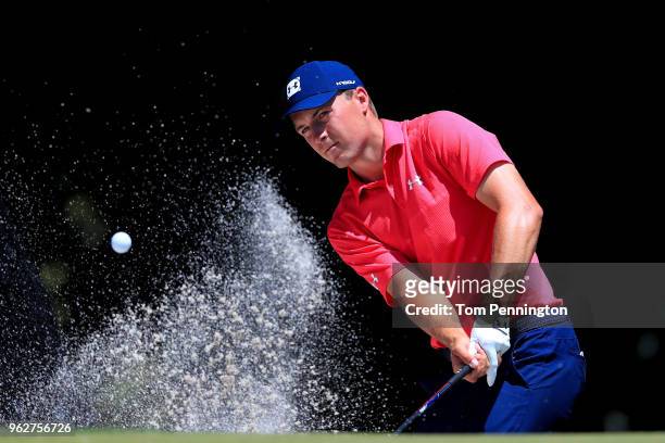 Jordan Spieth plays a shot from a bunker on the eighth hole during round three of the Fort Worth Invitational at Colonial Country Club on May 26,...