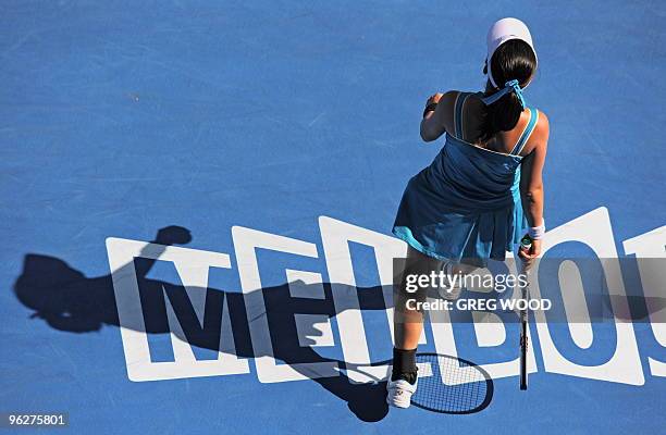 Zheng Jie of China walks across the court as she plays against Justine Henin of Belgium in their women's singles semi-final match on day 11 of the...