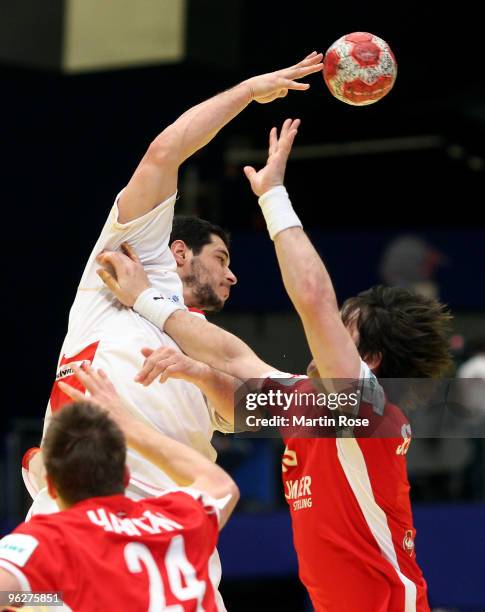 Hans Lindberg of Denmark blocks Carlos Peitro of Spain during the Men's Handball European qualifyer place 5 match between Denmark and Spain at the...