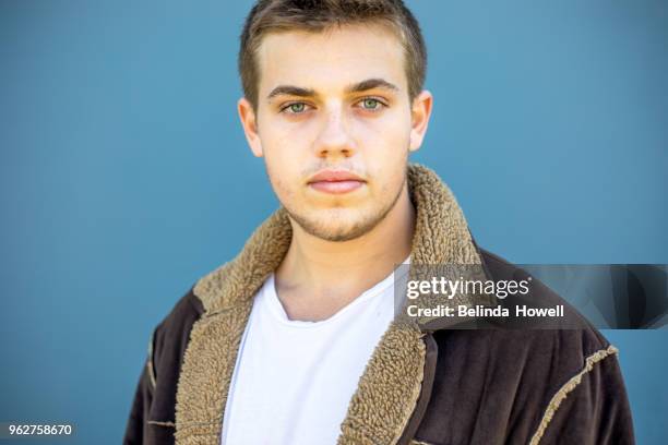 young male posing for camera - cabello-castaño fotografías e imágenes de stock