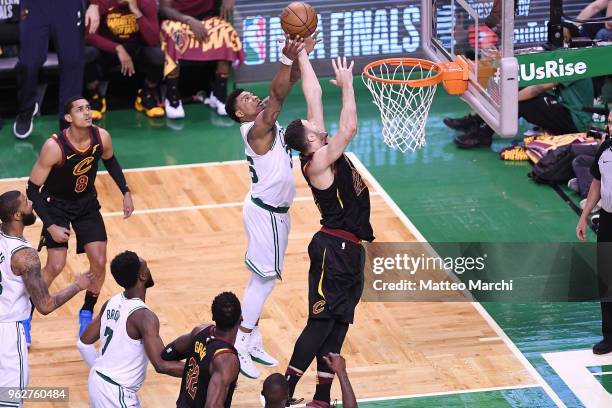 Marcus Smart of the Boston Celtics grabs a rebound against Larry Nance Jr. #22 of the Cleveland Cavaliers during Game Five of the 2018 NBA Eastern...