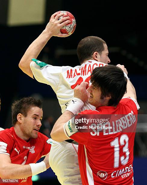 Bo Spellerberg of Denmark blocks Cristian Malmagro of Spain during the Men's Handball European qualifyer place 5 match between Denmark and Spain at...