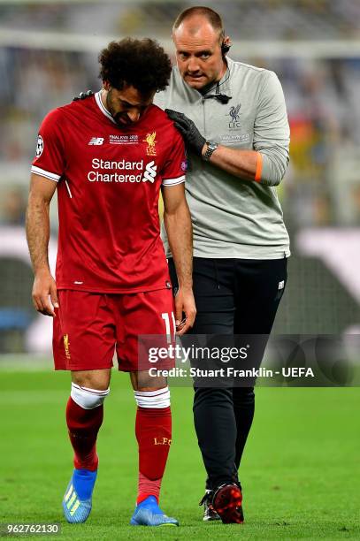 Mohamed Salah of Liverpool reacts whilst leaving the pitch injured during the UEFA Champions League Final between Real Madrid and Liverpool at NSC...