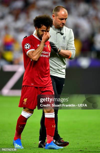 Mohamed Salah of Liverpool reacts whilst leaving the pitch injured during the UEFA Champions League Final between Real Madrid and Liverpool at NSC...