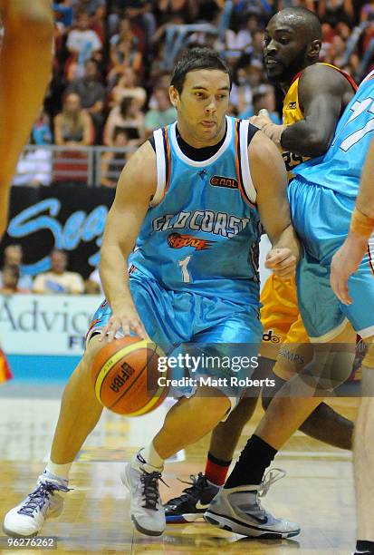 Adam Gisbson of Gold Coast Blaze dribbles the ball during the round 18 NBL match between the Gold Coast Blaze and the Melbourne Tigers at Gold Coast...