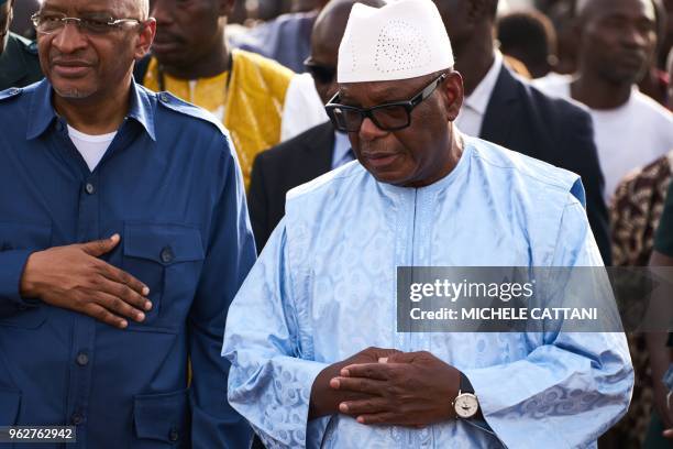 Malian president Ibrahim Boubacar Keita and Malian prime minister Soumeylou Boubèye Maiga attend the funeral of a griot singer Kasse Mady Diabate on...
