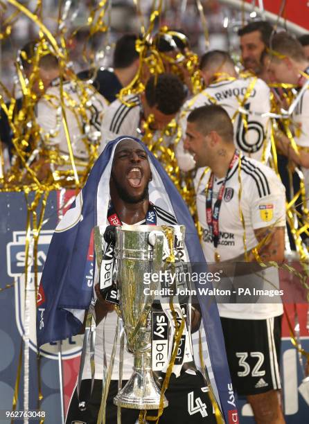 Fulham's Aboubakar Kamara with the trophy after the final whistle during the Sky Bet Championship Final at Wembley Stadium, London.