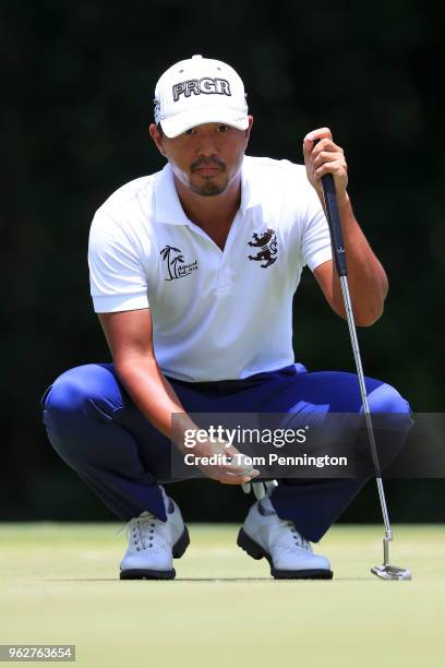 Satoshi Kodaira of Japan looks over a putt on the fifth green during round three of the Fort Worth Invitational at Colonial Country Club on May 26,...