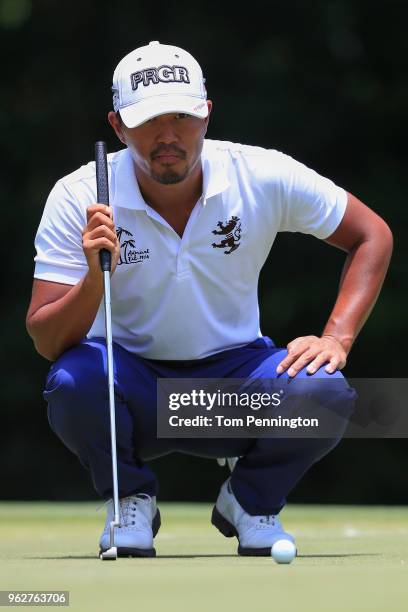 Satoshi Kodaira of Japan looks over a putt on the fifth green during round three of the Fort Worth Invitational at Colonial Country Club on May 26,...