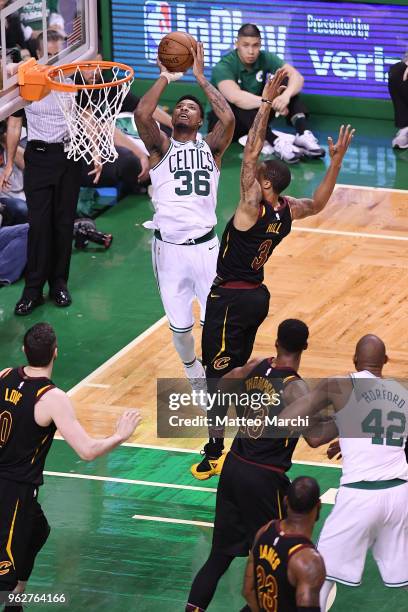 Marcus Smart of the Boston Celtics shoots the ball against George Hill of the Cleveland Cavaliers during Game Five of the 2018 NBA Eastern Conference...