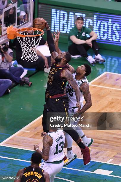 LeBron James of the Cleveland Cavaliers grabs a rebound against Marcus Smart of the Boston Celtics during Game Five of the 2018 NBA Eastern...