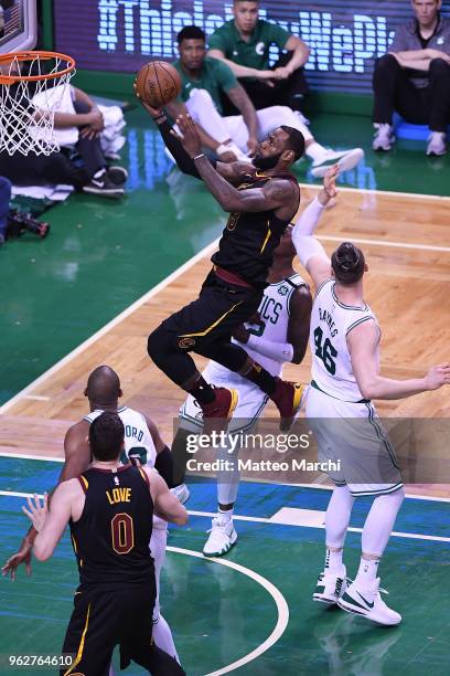 LeBron James of the Cleveland Cavaliers lays up a shot against Aron Baynes of the Boston Celtics during Game Five of the 2018 NBA Eastern Conference...