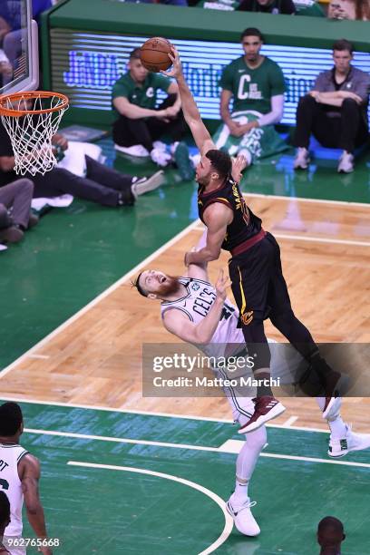 Larry Nance Jr. #22 of the Cleveland Cavaliers dunks the ball against Aron Baynes of the Boston Celtics during Game Five of the 2018 NBA Eastern...