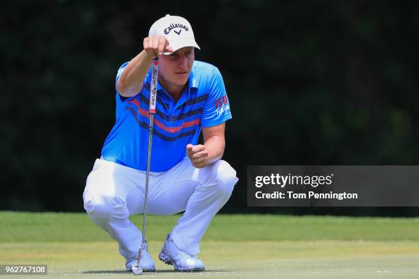 Emiliano Grillo of Argentina looks over a putt on the fifth green during round three of the Fort Worth Invitational at Colonial Country Club on May...