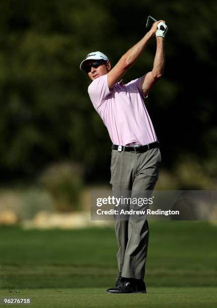 Brett Rumford of Australia hits his second shot on the ninth hole during the third round of the Commercialbank Qatar Masters at Doha Golf Club on...