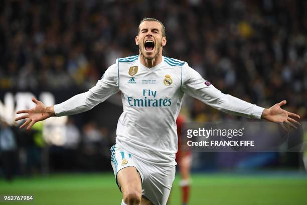 Real Madrid's Welsh forward Gareth Bale celebrates after scoring his team's second goal during the UEFA Champions League final football match between...
