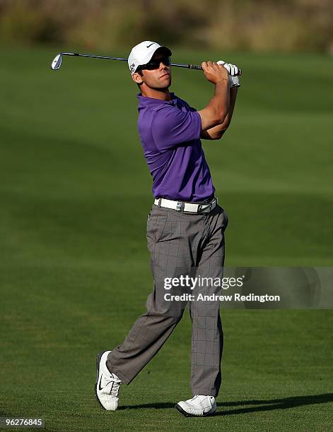 Paul Casey of England plays his third shot on the 18th hole during the third round of the Commercialbank Qatar Masters at Doha Golf Club on January...