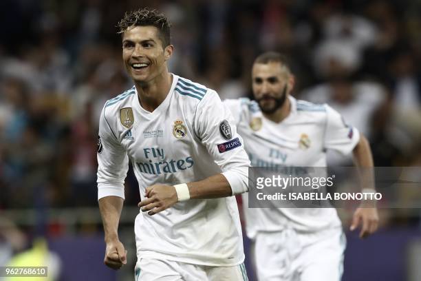 Real Madrid's Portuguese forward Cristiano Ronaldo cele brates after Real Madrid's Welsh forward Gareth Bale scored a goal during the UEFA Champions...