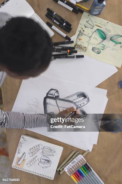 graphic designer working in modern studio space - fashion day at the artists project stock pictures, royalty-free photos & images