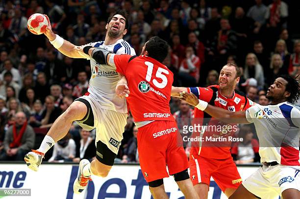 Alexander Petersson of Iceland shoots over Nikola Karabatic of France during the Men's Handball European semi final match between Iceland and France...