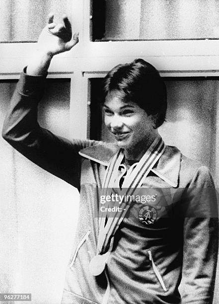 East Germany's swimmer Rica Reinisch salutes the public while on podium with her gold medal won in the women's 200 meter backstroke final, 27 July...