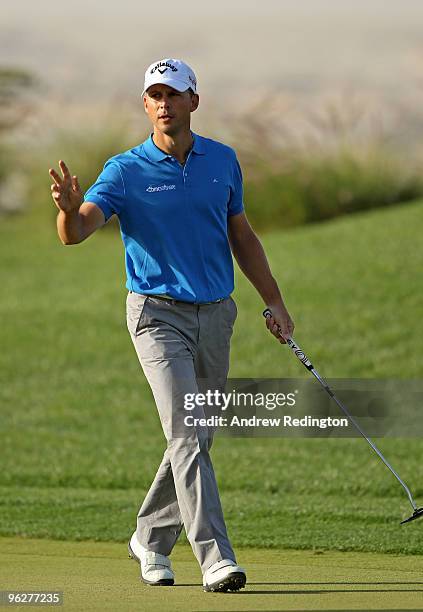 Niclas Fasth of Sweden celebrates after holing a birdie putt on the 17th hole during the third round of the Commercialbank Qatar Masters at Doha Golf...