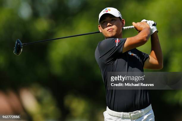 Si Woo Kim of Korea plays his shot from the 18th tee during round three of the Fort Worth Invitational at Colonial Country Club on May 26, 2018 in...