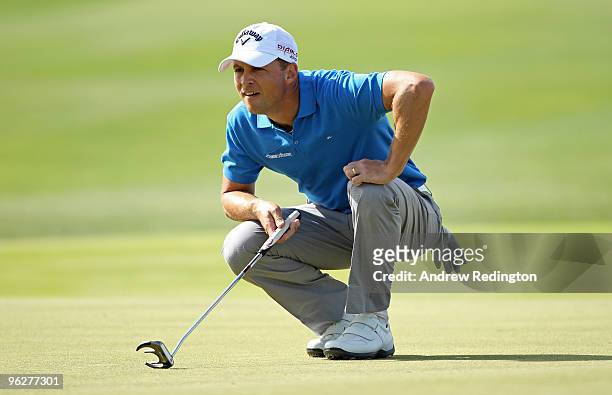 Niclas Fasth of Sweden lines up a putt on the third hole during the third round of the Commercialbank Qatar Masters at Doha Golf Club on January 30,...