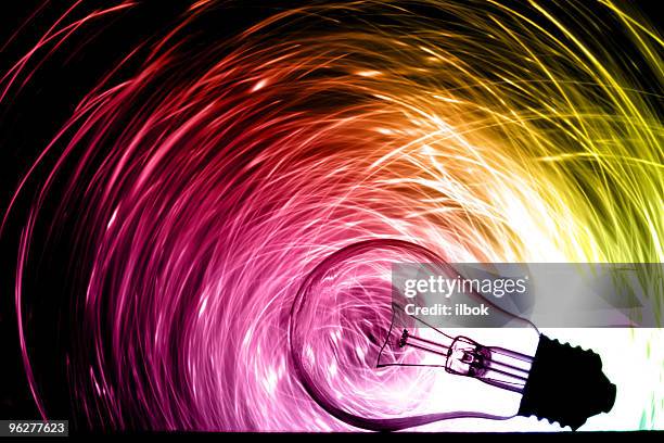 abstract light bulb shining various colors - idea bulb stockfoto's en -beelden