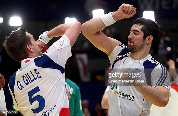 Guillaume Gille of France celebrates with team mate Nikola Karabatic after the Men's Handball European semi final match between Iceland and France at...