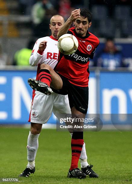 Nikos Liberopoulos of Frankfurt is challenged by Miso Brecko of Koeln during the Bundesliga match between Eintracht Frankfurt and 1. FC Koeln at the...