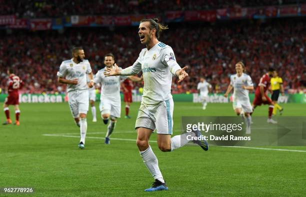 Gareth Bale of Real Madrid celebrates after scoring his sides third goal during the UEFA Champions League Final between Real Madrid and Liverpool at...